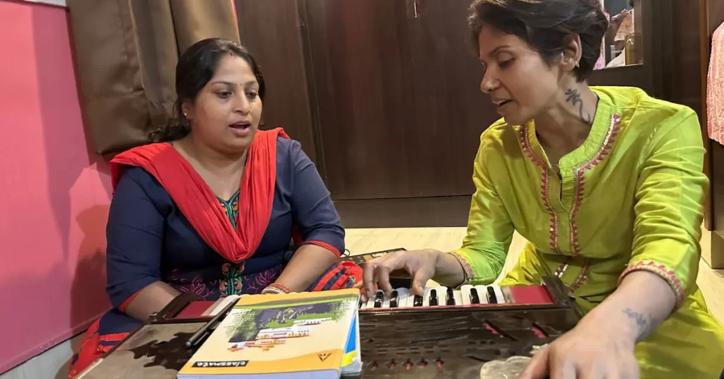 Madhumita Chakraborty teaching a student harmonium and vocal techniques at Giti Alekhya, an Indian classical music school in Kolkata known for personalized training in Hindustani classical singing.
